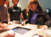 Tilman and Roman demonstrating Painstation. Tilman tells the two 
excited players to relax, and focus.